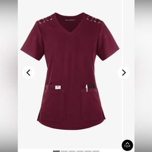 Size 2X scrub top. Very soft stretch material. Excellent condition.
